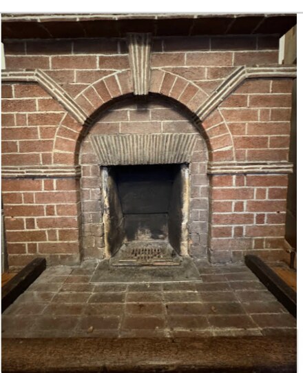 Restored Victorian brick arch open fireplace